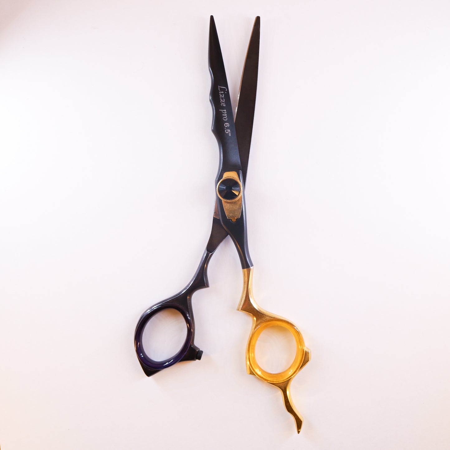Lizze Pro 6.5-inch black and gold hairdressing scissors for precision cutting and style.