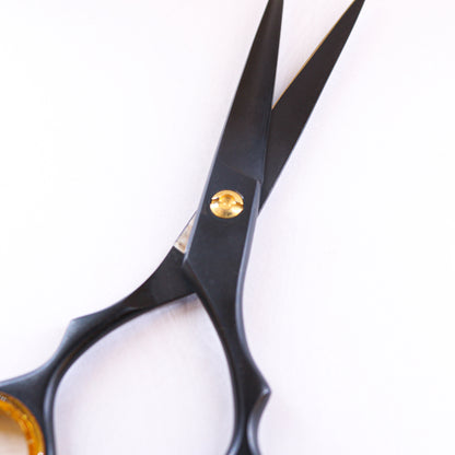 Lizze Pro 6.5-inch black and gold professional barber shears for precision cutting.