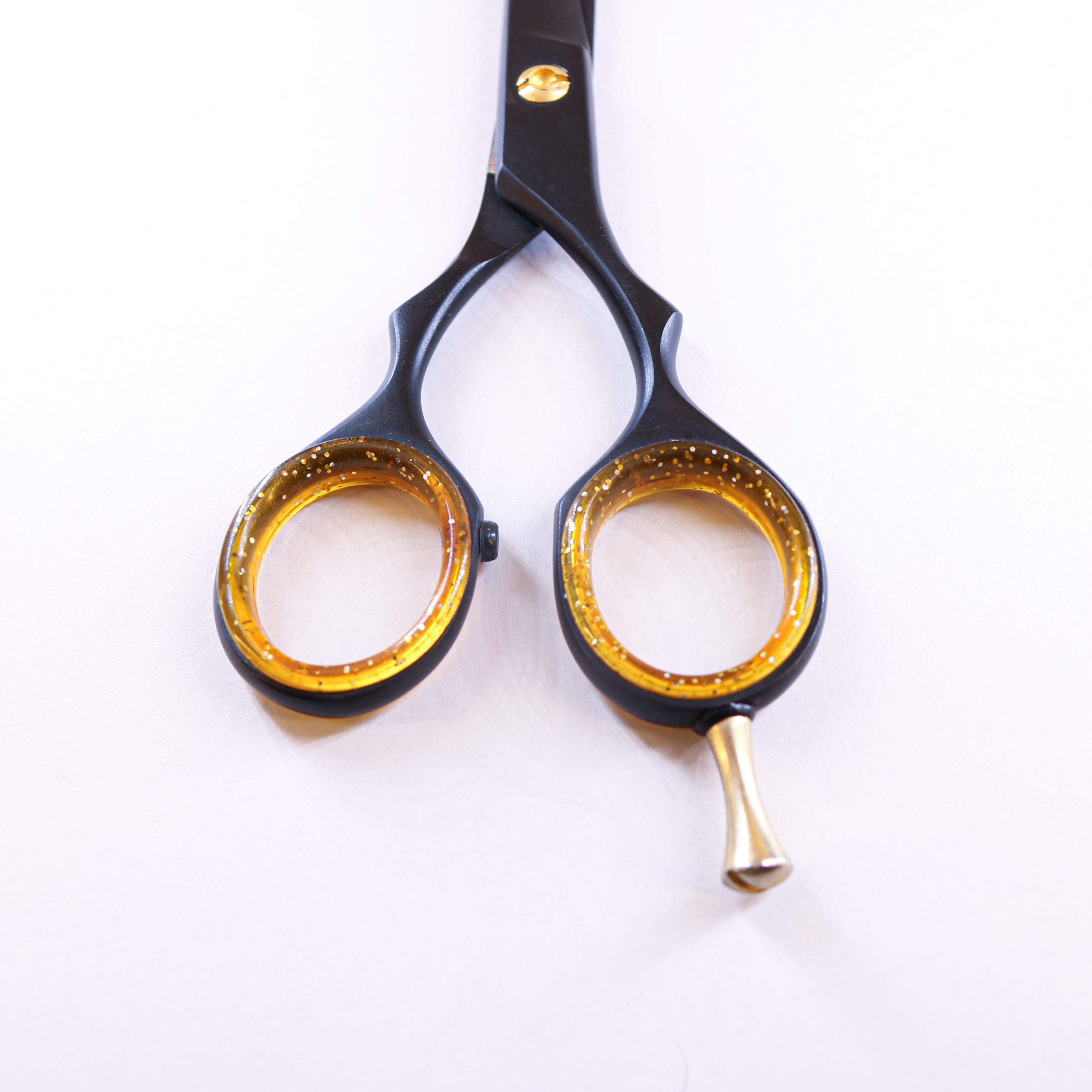 Lizze Pro 6.5-inch black and gold professional barber shears for precision cutting.