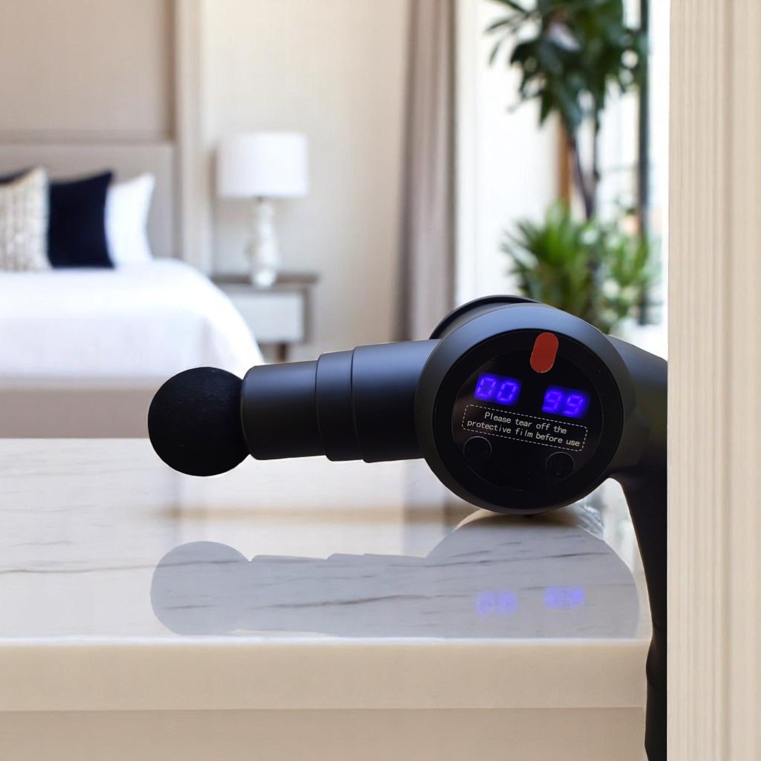 Massage gun in use on arm after gym session